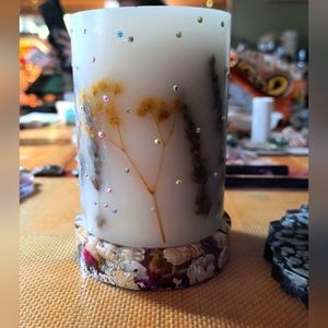 Beautiful hand set crystal candle and hand poured candle base.  Roses, seashells